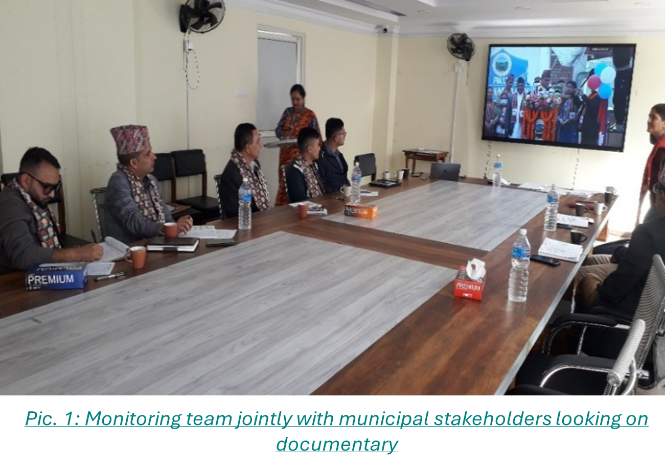 Pic. 1: Monitoring team jointly with municipal stakeholders looking on documentary